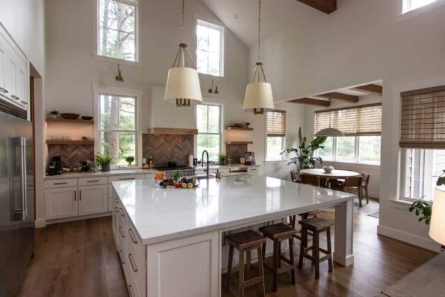 Kitchen Island – 9’ x 8’ quartz island in color French Lace, Wellborn Cabinets in color Glacier